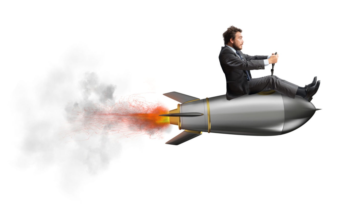 Businessman flying over a rocket. concept of company startup